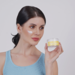 Woman applying day cream for sensitive skin